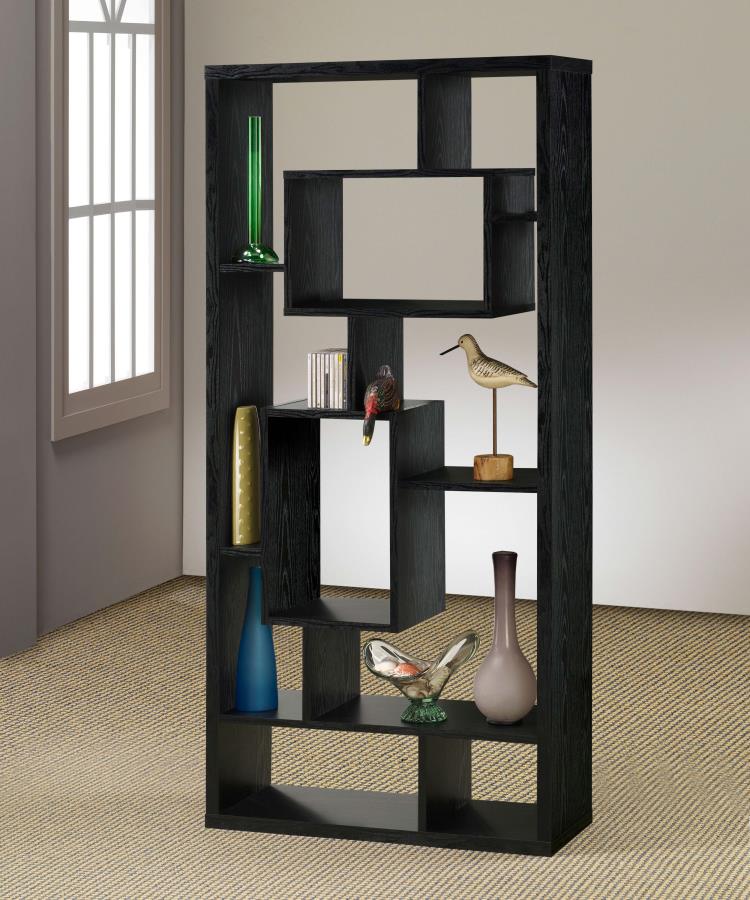 A black geometric bookcase with multiple compartments, in a flat-packed state, and decorative pieces on display