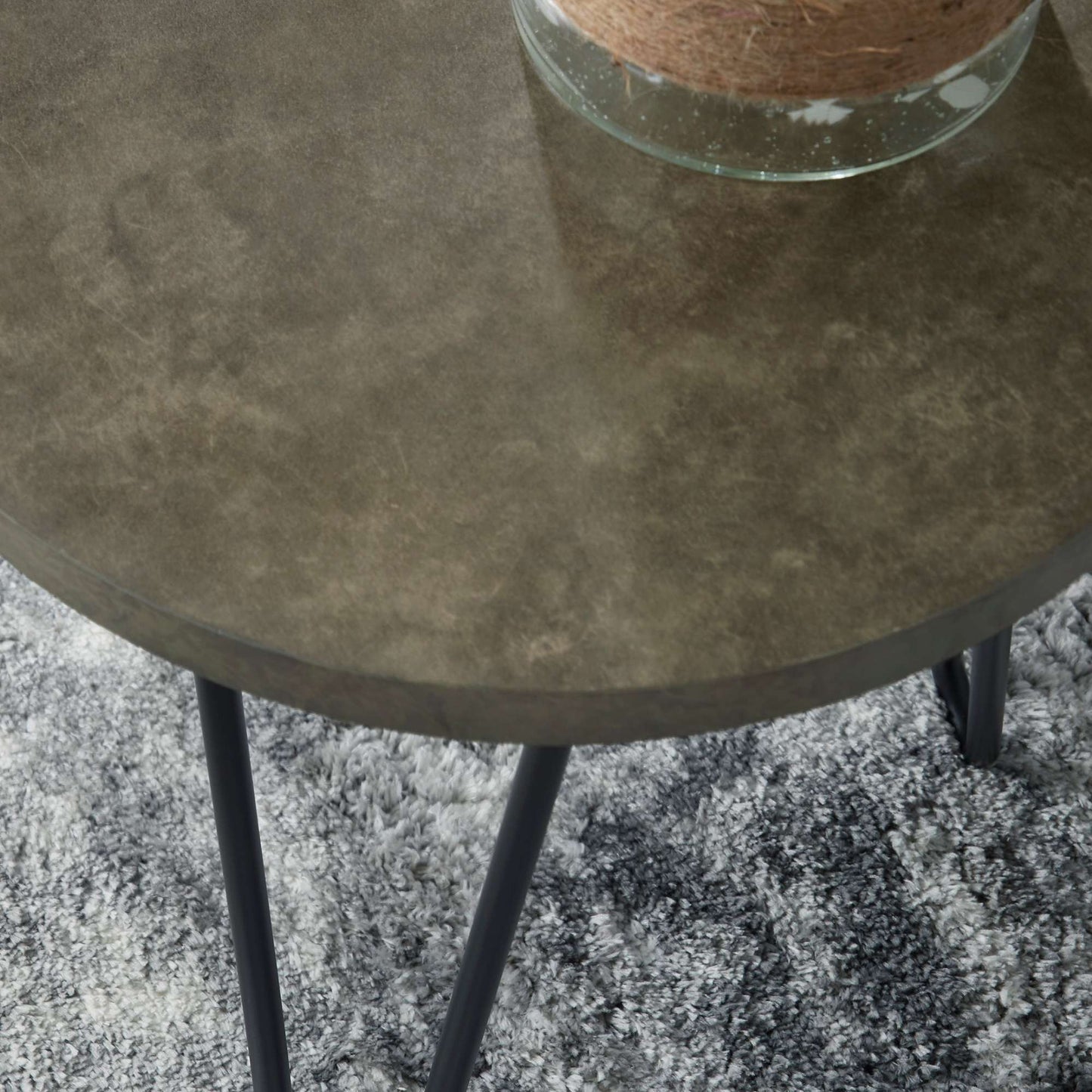Charlene brown toned top with black metal legs on carpet setting