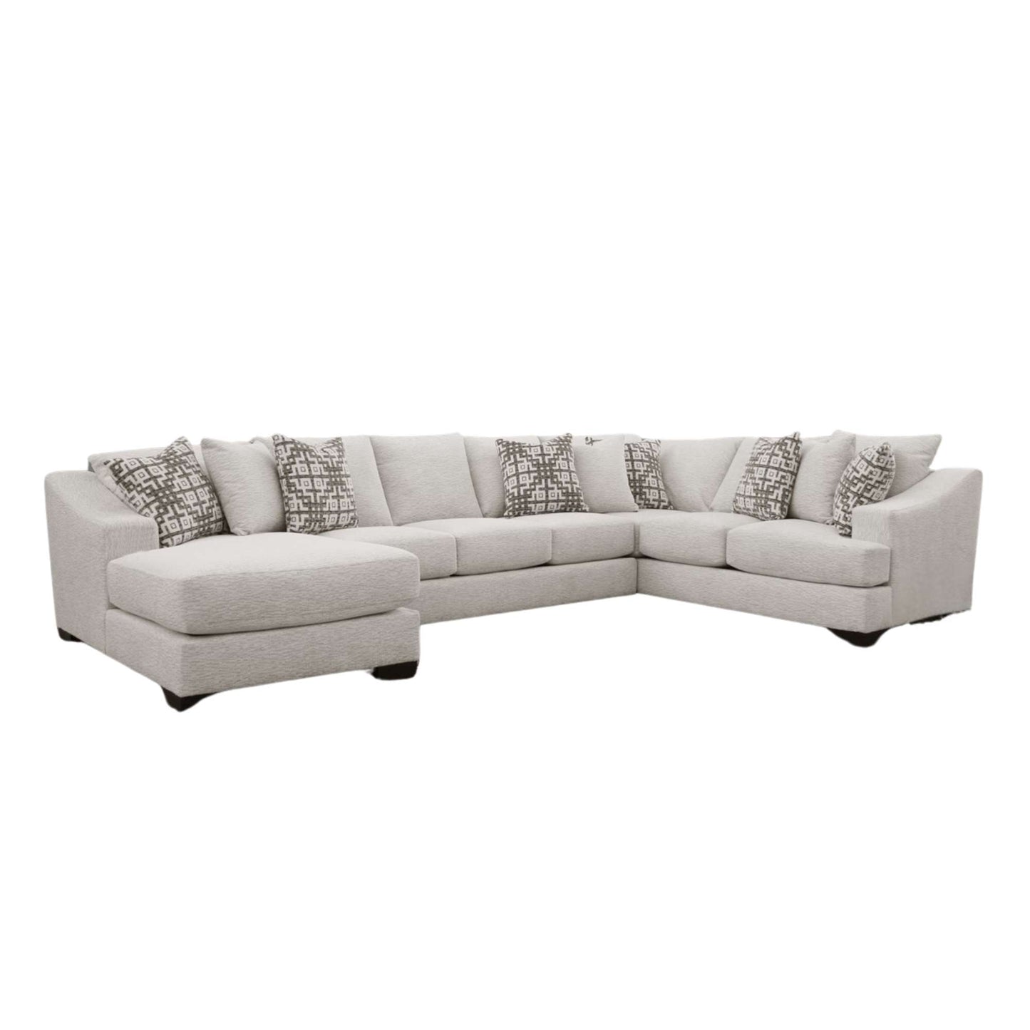 A 3 piece sectional sofa with chaise in living white upholstery, including an arm sofa tux, an armless sofa, and an arm chaise, with decorative accent pillows.