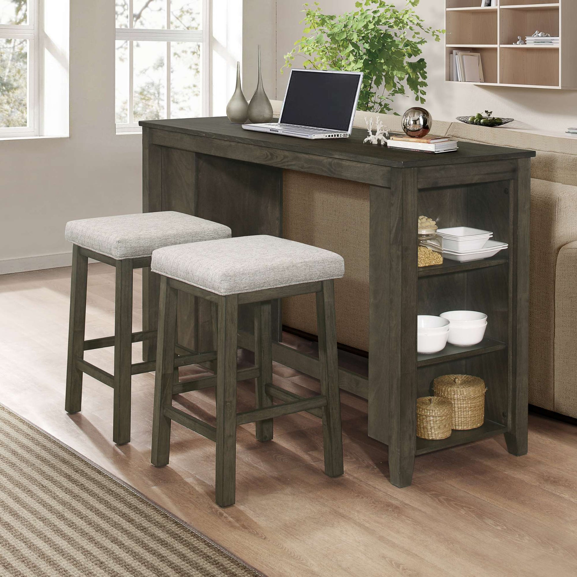 Andres grey counter height table with stools in a living room setting