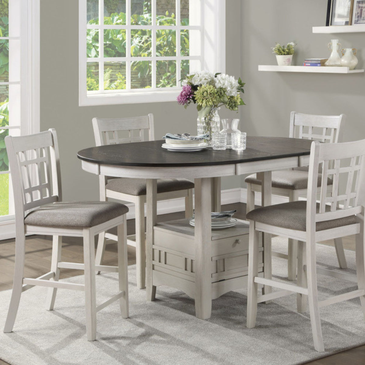 Arlet five piece counter height dining table set with oval table top and extension leaf with pedestal storage in dining room setting. 