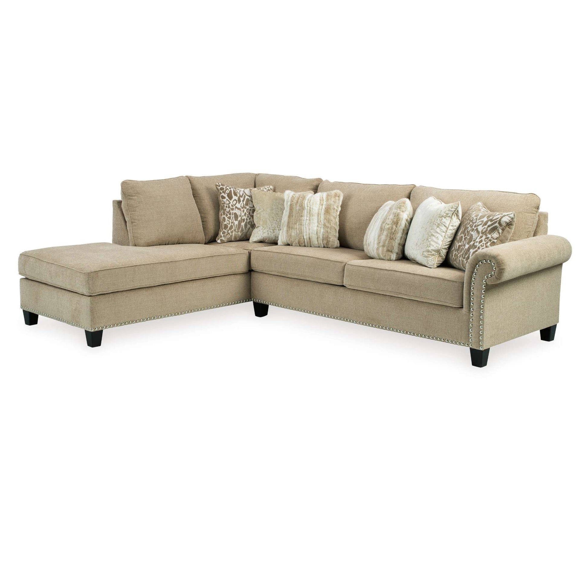 Beige sectional sofa with patterned pillows on a white background