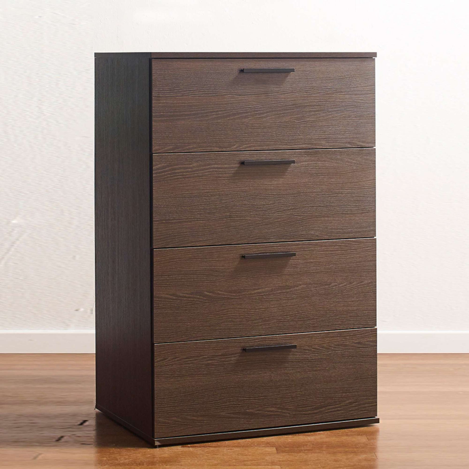 A rustic espresso brown 4-drawer chest with extension gliders, placed against a plain background on a wooden floor.