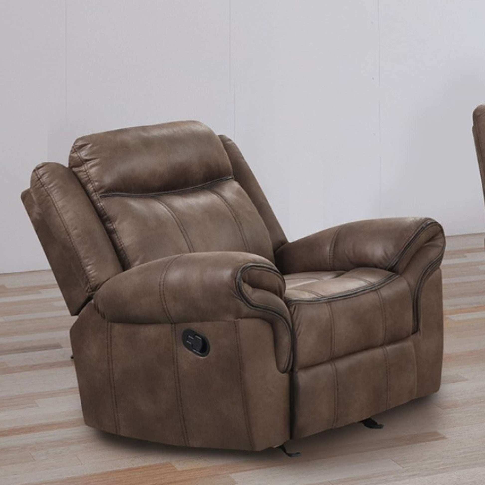 Casimir Brown faux leather recliner chair on a wooden floor with a white wall background