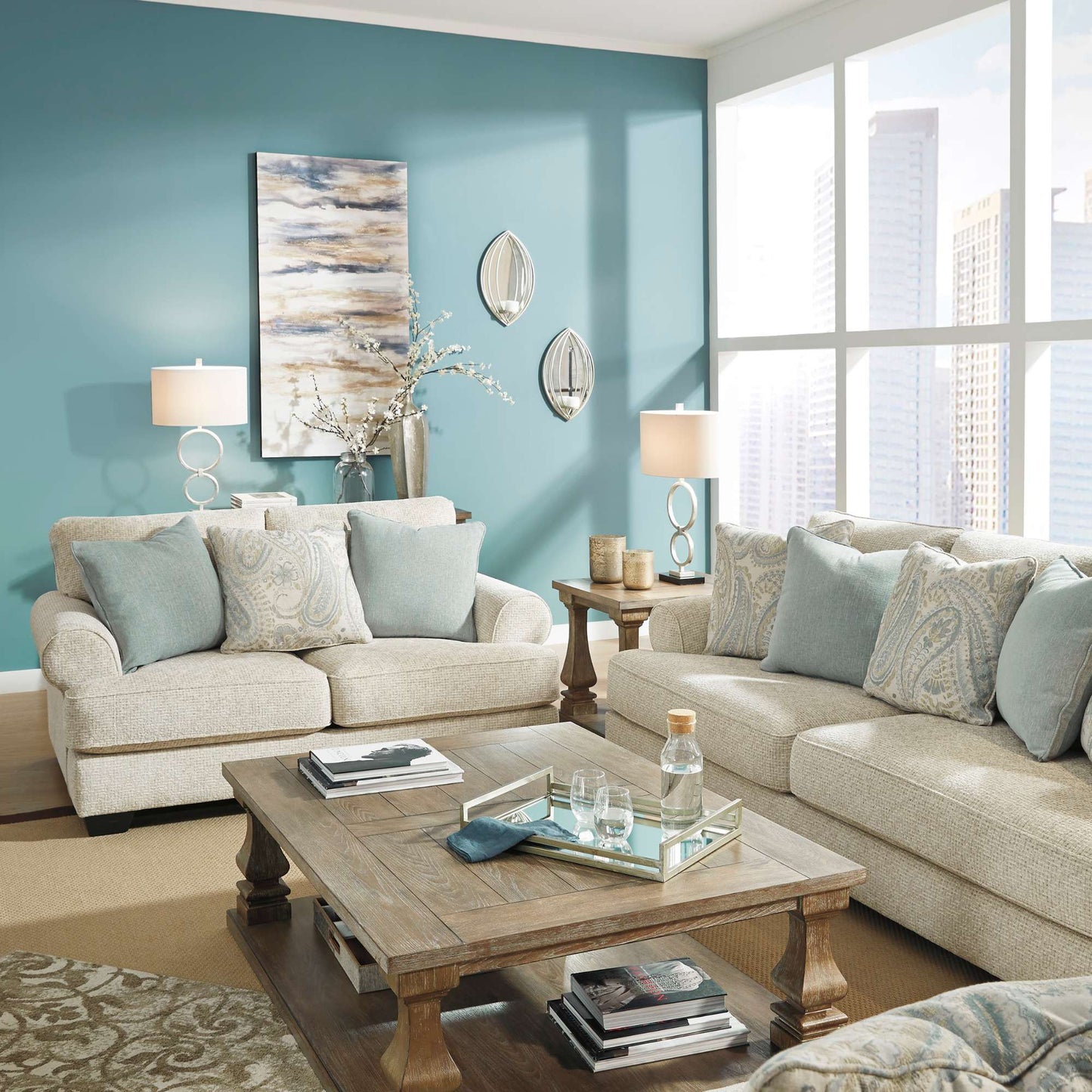 Living room with beige sofa, wooden coffee table, and blue walls.