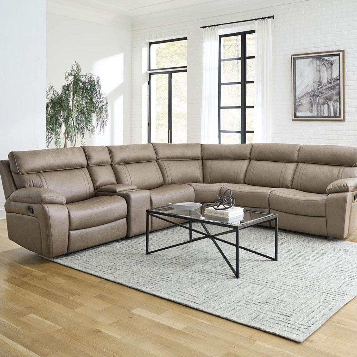 6 PC Graymen motion modular sectional in stokes toffee faux leather in living room setting with decor. 
