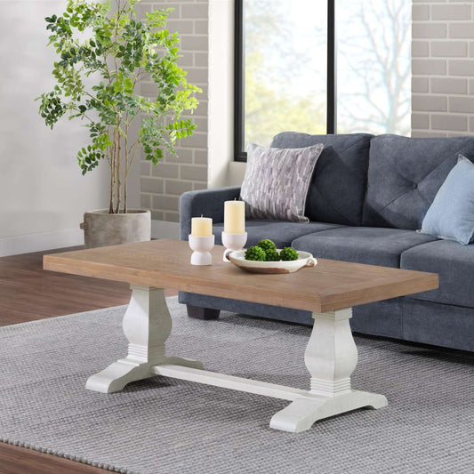 Griggs coffee table with rustic white base and light brown driftwood top in living room setting