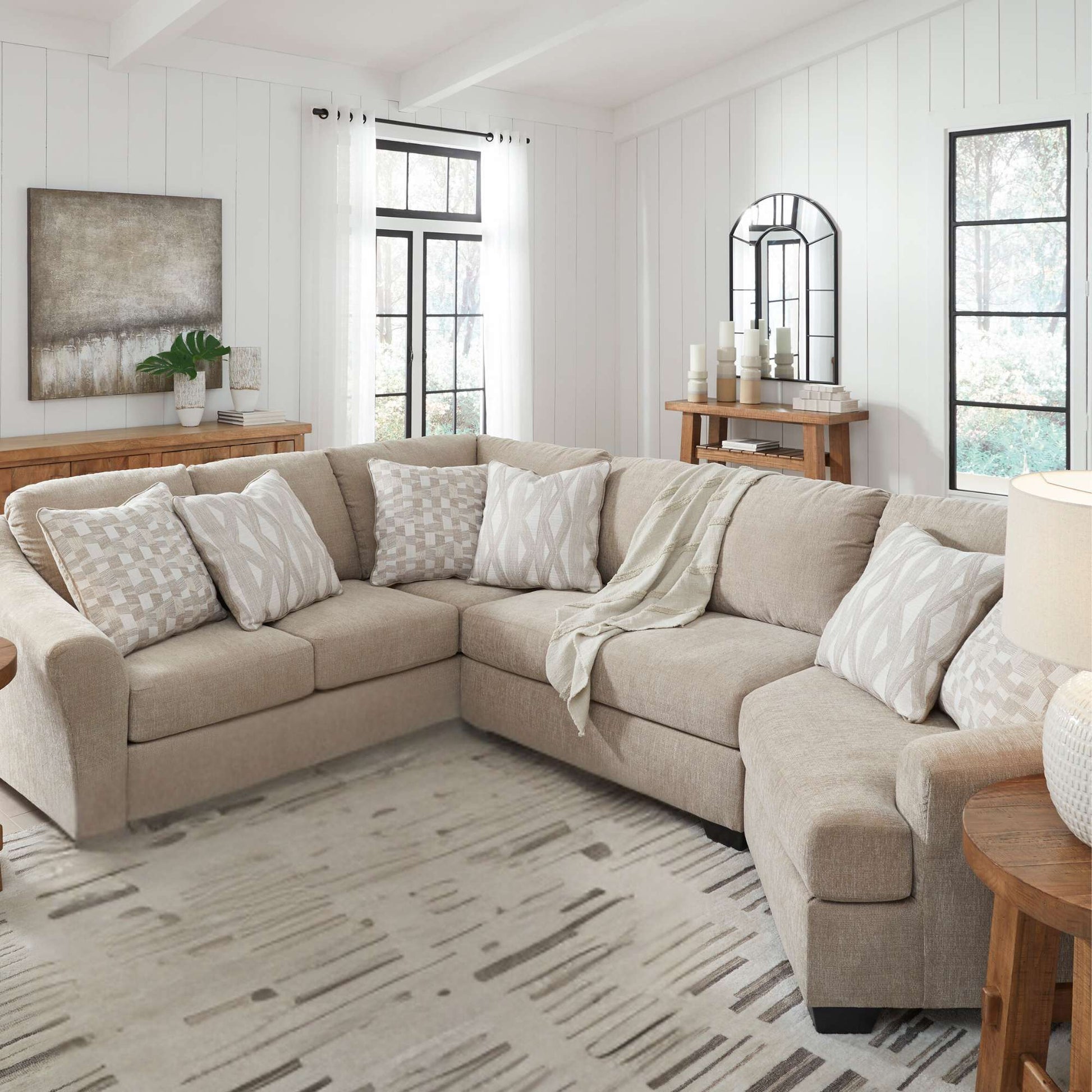 Grover 3 piece sectional with cuddler in living room setting and blanket accent