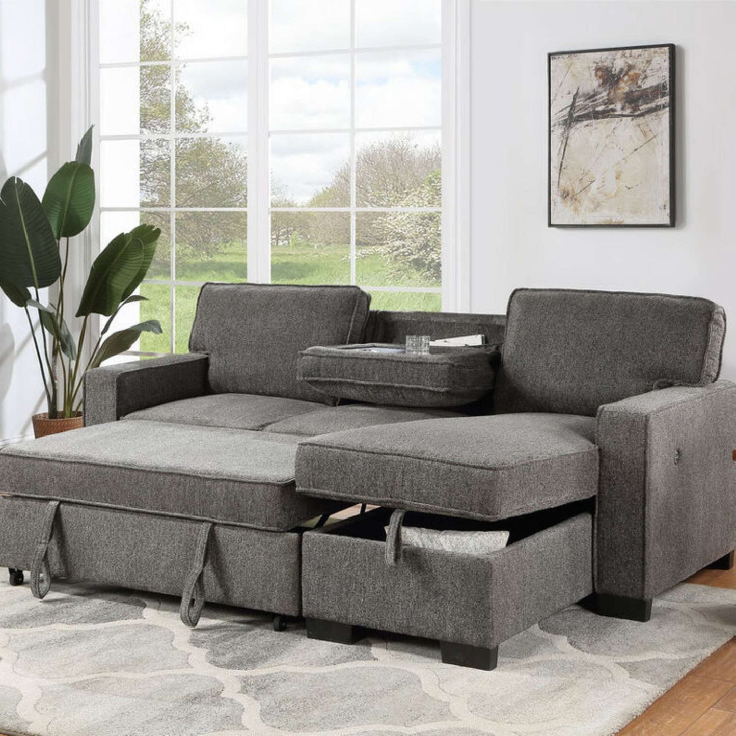Gray sectional sofa with storage drawers in a living room setting.