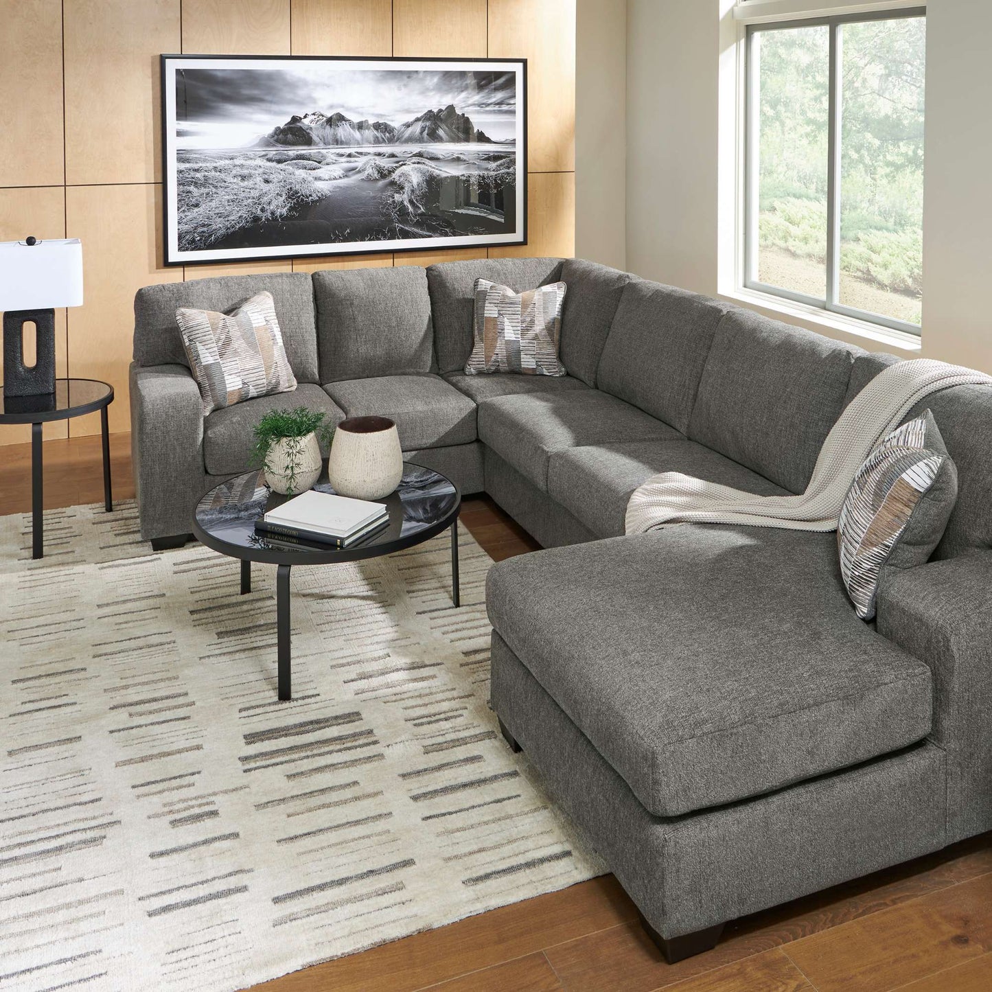 Kincaid 3 PC sectional includes an arm chaise, armless loveseat, and right-arm sofa with corner wedge. Displayed in living room setting and accents. 