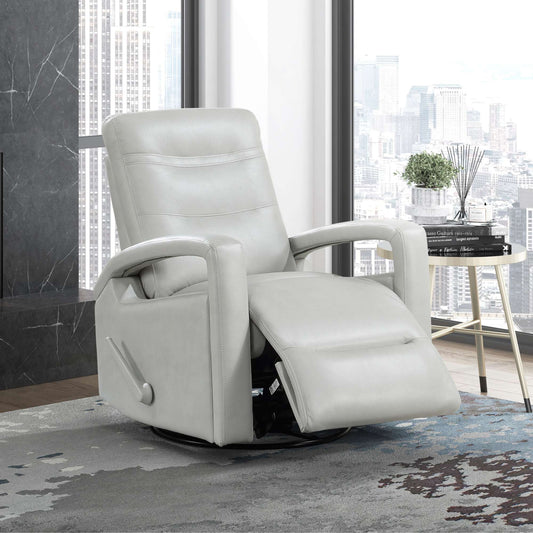 White recliner chair in a modern room with large windows.