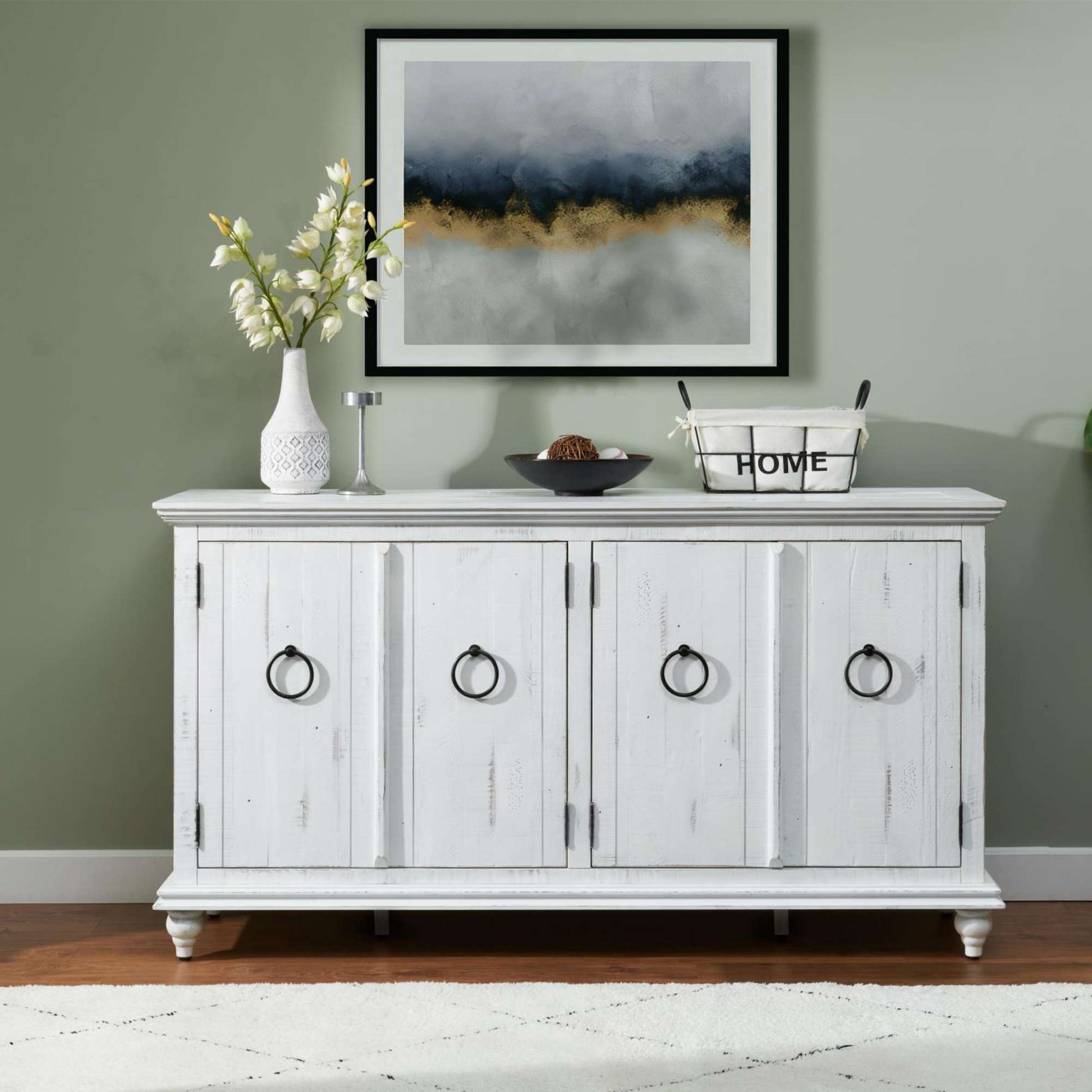 Mervyn White distressed sideboard with decorative items against a green wall