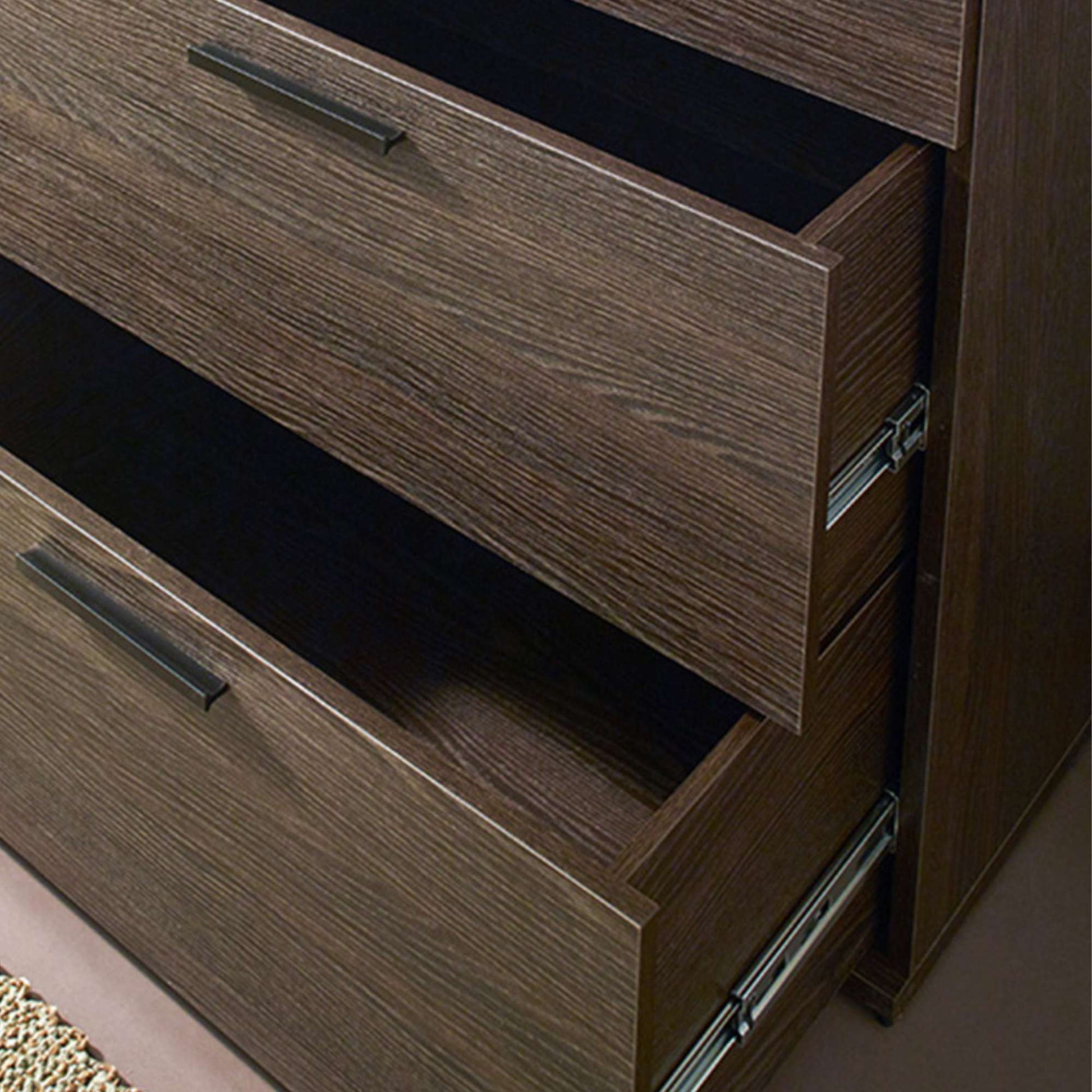 Close-up of a wooden dresser with open drawers