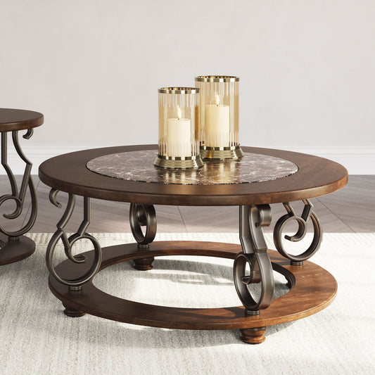 Sania Round wooden coffee table with decorative legs and two candles on a light background