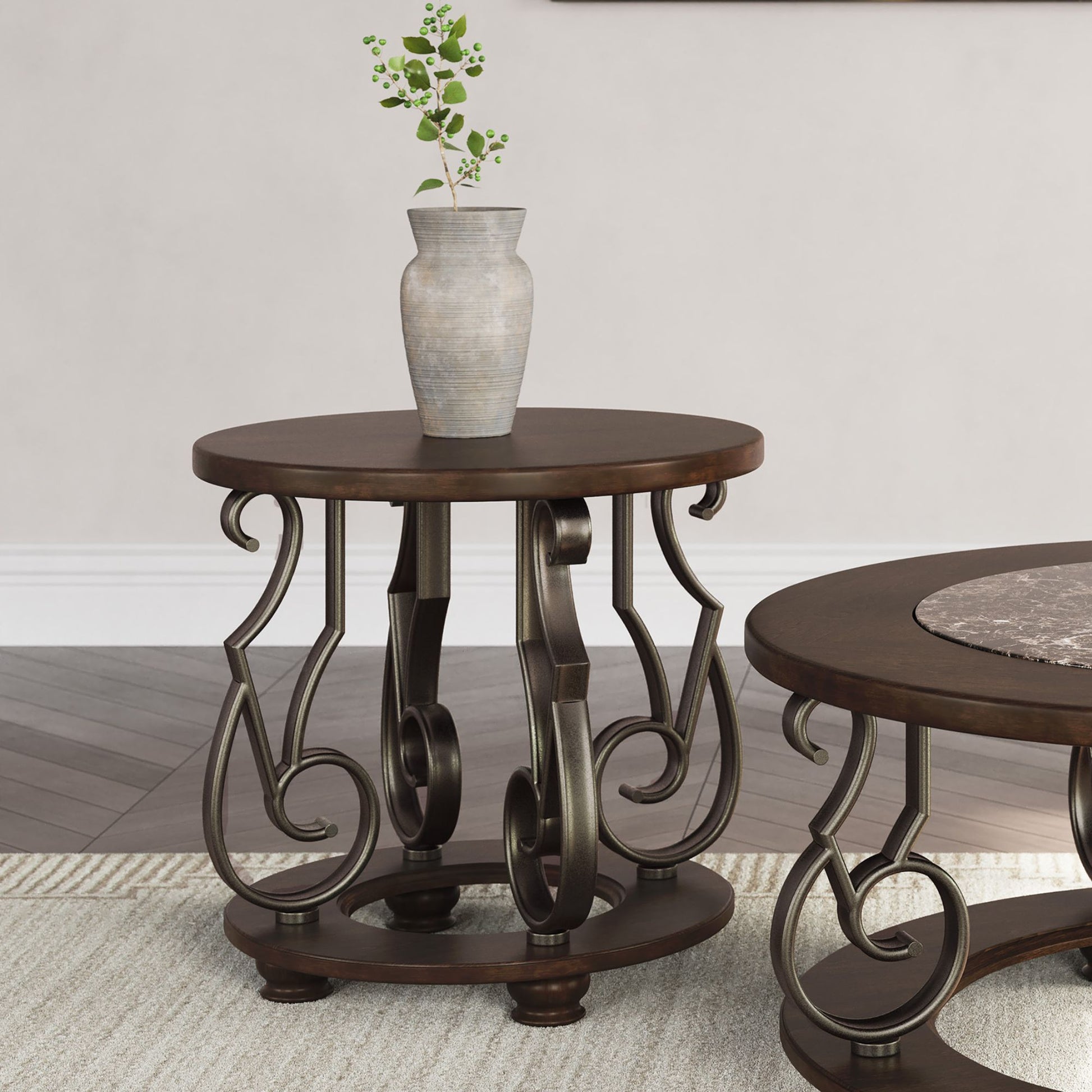 Round wooden side table with decorative metal legs on a neutral background