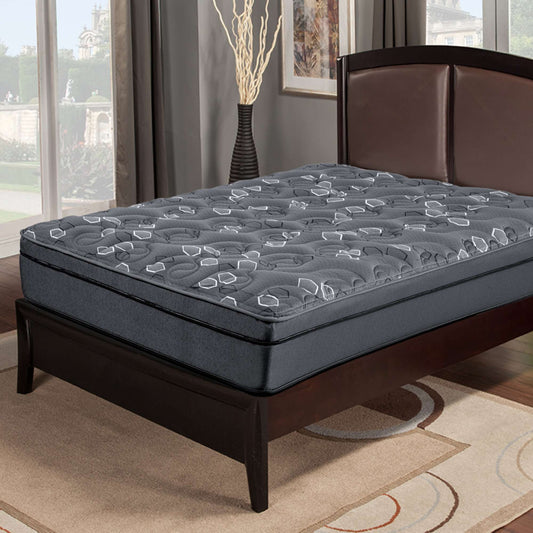 Gray mattress on a wooden bed frame in a room with large windows.