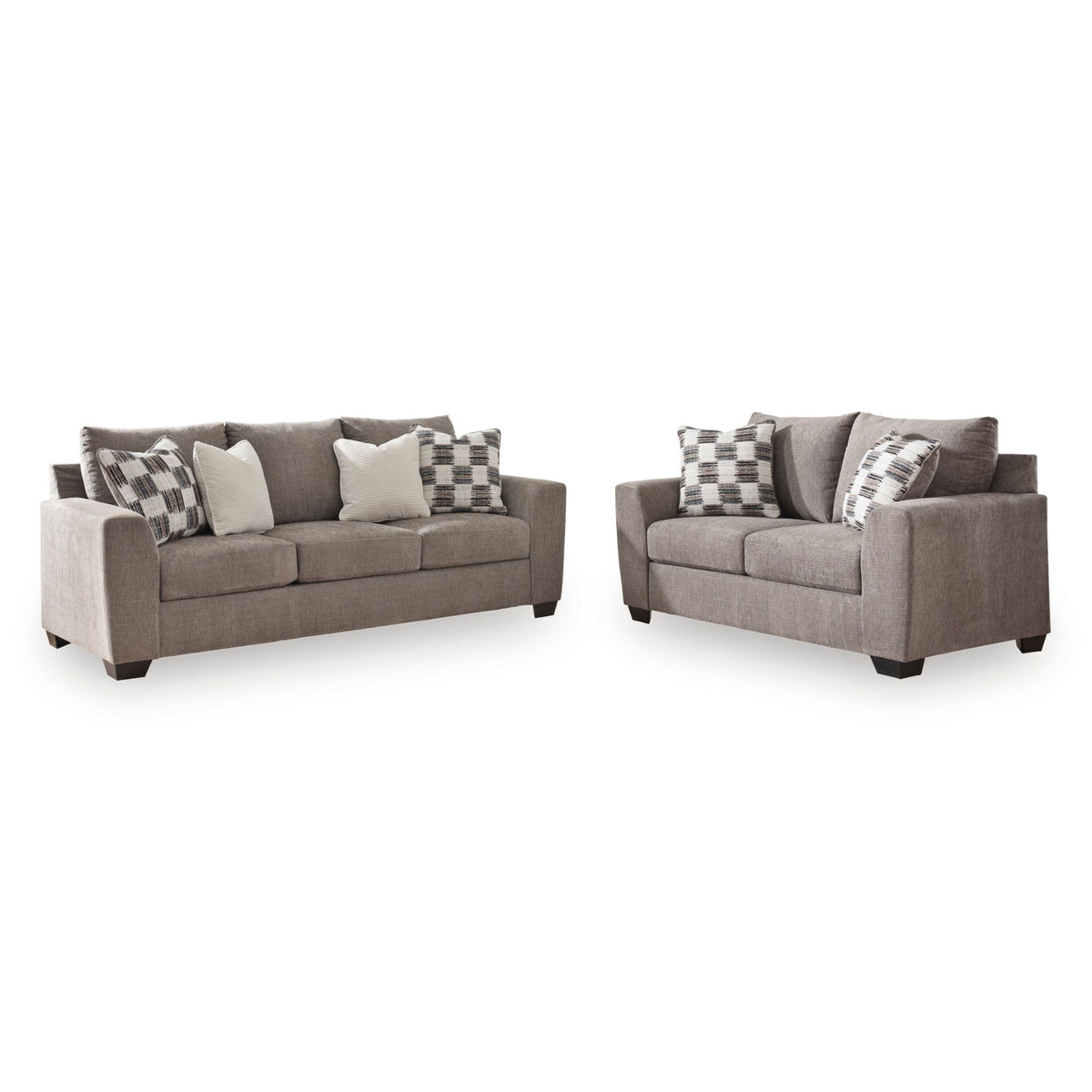 A Teelgan two-piece living room furniture set consisting of a three-seat sofa and a two-seat loveseat in a textured taupe fabric, styled with gray and white patterned throw pillows, on a solid white background.