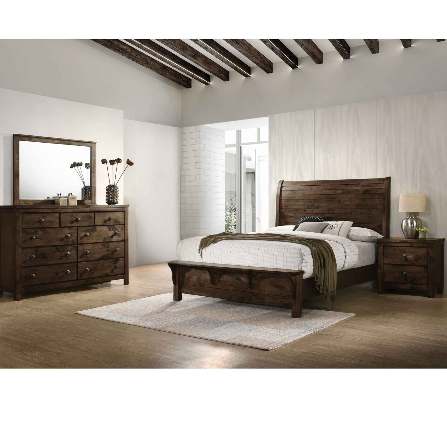 Wooden bedroom set with bed, dresser, and nightstands in a room with wooden beams.